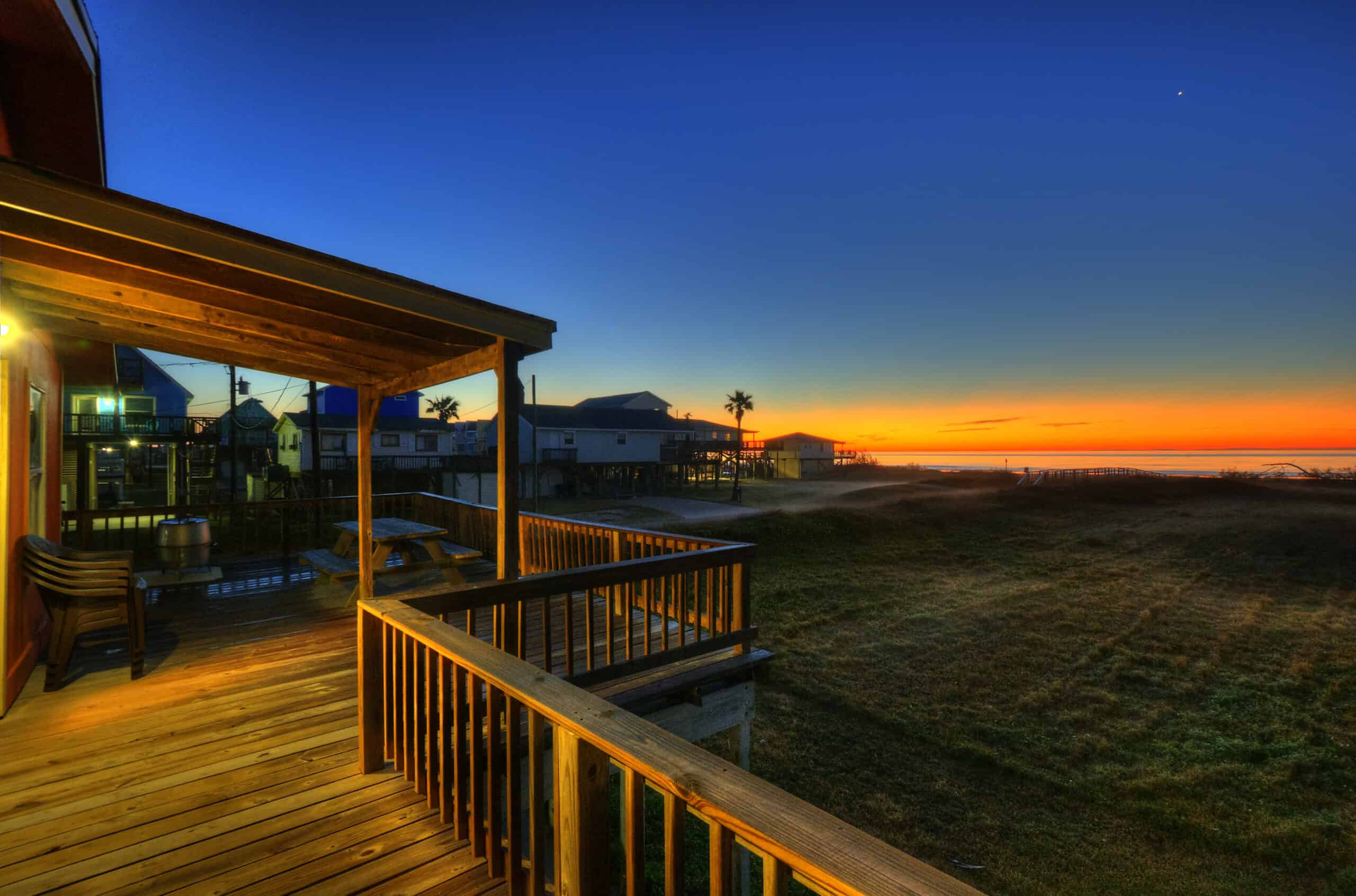 https://beachhouses.com/wp-content/uploads/2022/04/Beachcomber-Deck-Sunrise-1-scaled.jpg